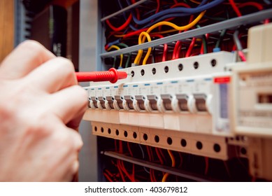 Electrical Equipment. Tester In The Hands.  Background And Texture