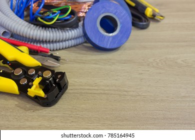 Electrical equipment.Electrical tools  and power cables for installation and network connection.Wooden background,space for text.