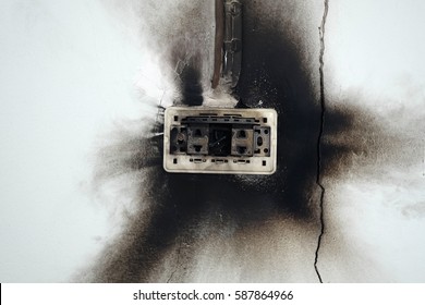 Electrical Failure In Power Outlet And Cracked Wall.