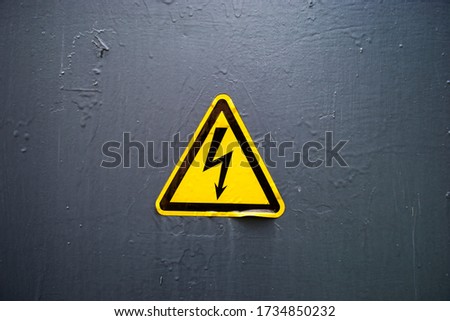 Electrical hazard label sticker on the gray background