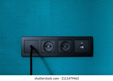 Electrical household switches and sockets close up. Minimalist interior design. Stylish bedroom and living room