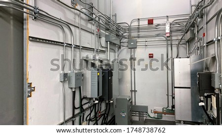 electrical installation lighting parkade panel infrastructure pipe work emt
