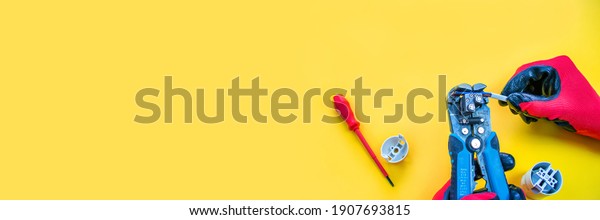 Electrical installation measuring instruments tools\
on a yellow background with copy space. place for text. Selective\
focus