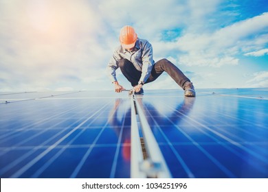 Electrical And Instrument Technician Use Wrench To Maintenance Electric System At Solar Panel Field