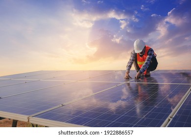 Electrical And Instrument Technician Use Wrench To Fix And Maintenance Electric System At Solar Panel Field.	