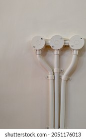 electrical junction boxes with PVC pipe electrical conduit installed on white wall