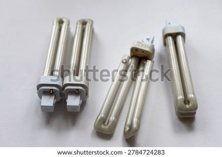 electrical maintenance tools and lighting components on workbench