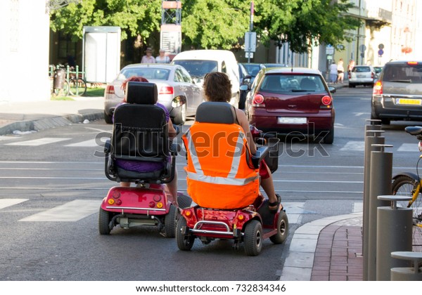 The electrical mobile wheelchair helps\
handicaped people to drive the urban road of the city together with\
cars and bicycles