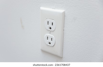 electrical outlet plug, symbolizing energy connection and electrical power source - Shutterstock ID 2361708437