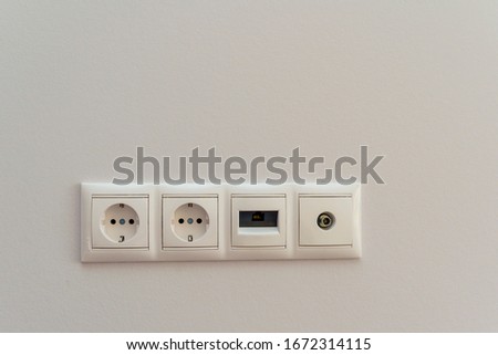 Electrical outlets, connectors for Internet and cable TV on the wall in the house with a new renovation.