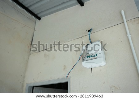 An electrical panel wall indoor installation wiring safety technology power box electrical panel installation indoor wall with exposed wiring safety concern and unfinished setup residential building