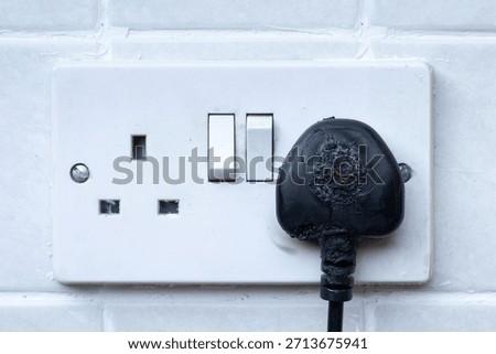 electrical plug and socket on fire 