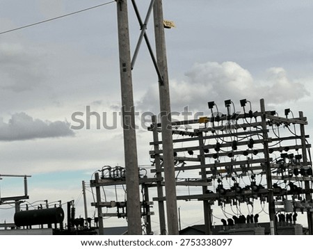 Electrical power distribution station with transformers and grid equipment in countryside