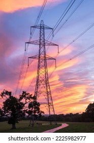 Electrical power lines and towers at sunset. - Shutterstock ID 2225982977