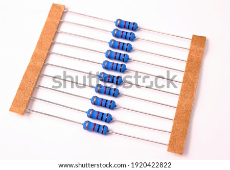 Electrical resistors for surface mounting on printed circuit board, isolated on white background.