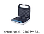 an electrical sandwich toaster on a white background