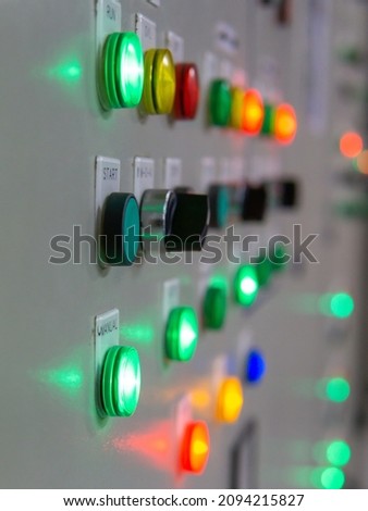 Electrical selector switch,button switch,Electrical switch gear at Low Voltage motor control center cabinet in coal power plant. blurred for background.