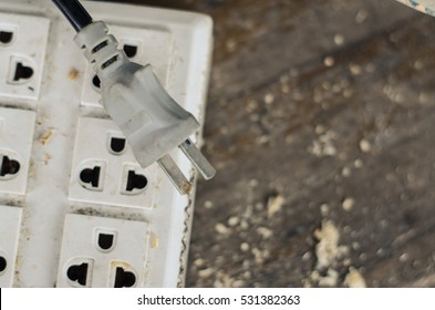 Electrical socket on wood background
