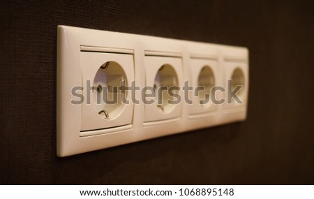 Electrical sockets on a wall 4 in a row. Type F, Schuko