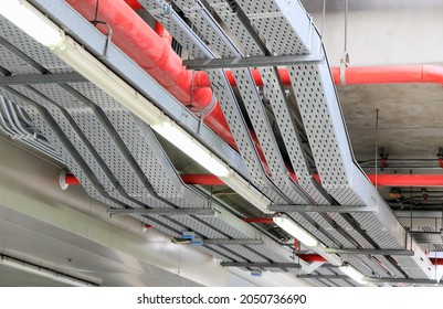 electrical steel pipe line, Electrical cable wire way on wall, cable routing between electrical distribution panel with equipment, industry construction concept background.