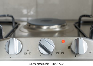 Electrical Stove Knob In Kitchen Work Top With Operation Light On