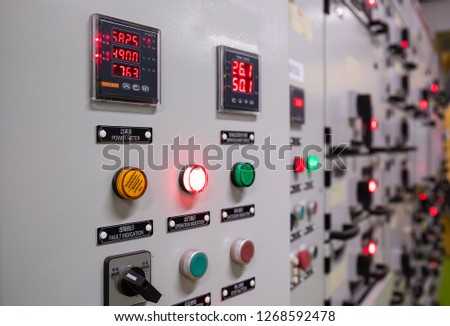 Electrical switch gear ,Digital meter at Low Voltage motor control center cabinet  in coal power plant. blurred for background.