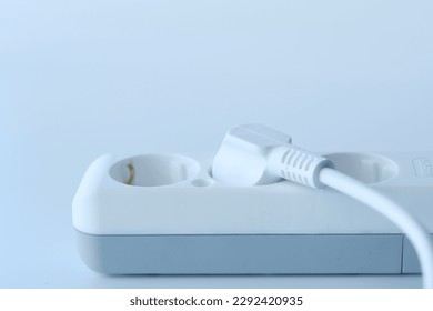 Electrical switch and plug on white background,