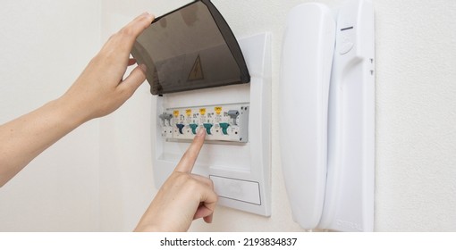 Electrical switchboard with automatic current switches. The concept of security in the apartment against a short circuit. Close-up - Shutterstock ID 2193834837