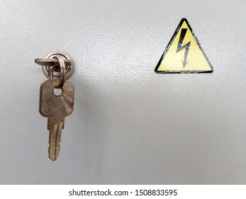 Electrical Switchboard With Key And Yellow Sign Danger Electricity On Steel Door