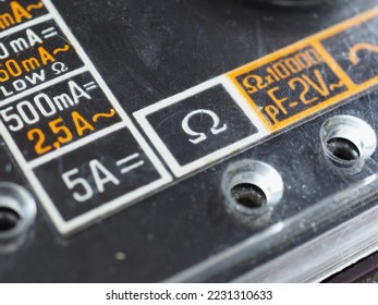 electrical symbols on a vintage analog multimeter measuring instrument - Shutterstock ID 2231310633