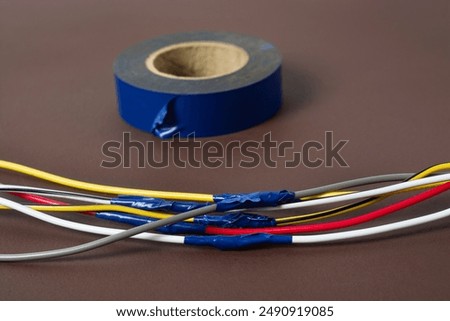 Electrical tape for insulating exposed wires.
