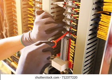 Electrical terminal in junction box and service by technician. Electrical device install in control panel for support program and control function by PLC. routine visit check equipment by technician.