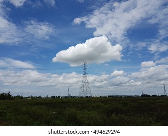 electrical tower and clouds 