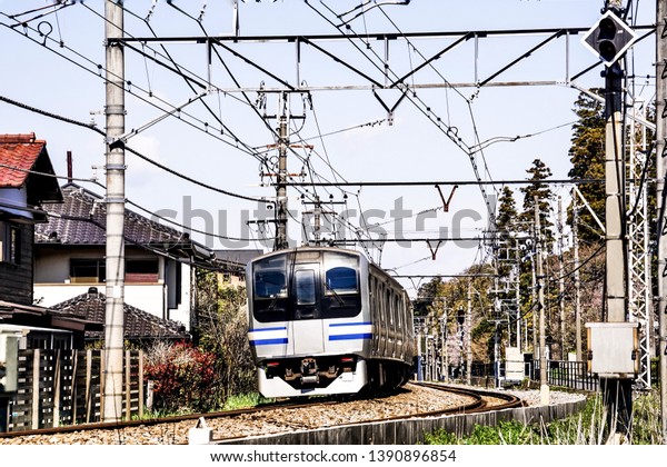 Electrical train\
on track and power lines. Electrical wiring and placement for\
trains. Electricity Transmission lines for trains that are placed\
in the same direction as railway\
tracks.