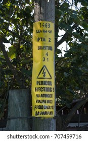 Electrical warning alert message on the wooden pole