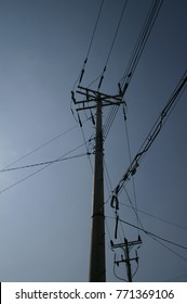 Electrical wire on pole and blue sky