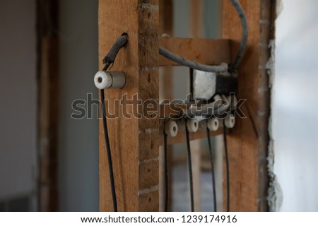 Electrical wires, Knob-and-tube, on a residential renovation site.