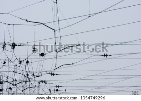 Similar – zahlreiche Schwalben sitzen auf den Freileitungen, die von einem alten Strommast ausgehen