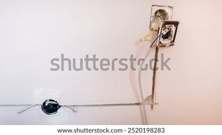Electrical wiring installation process captured inside a home under renovation demonstrates resolving household electrical issues