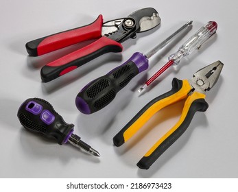 Electrical wiring tools such as plier, screw driver, screw philip, wire cutter and test pen on isolated background
