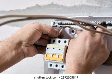 Electrical work to install new panel of electric distribution board consumer unit with fuse box or circuit breaker - Shutterstock ID 2192805849