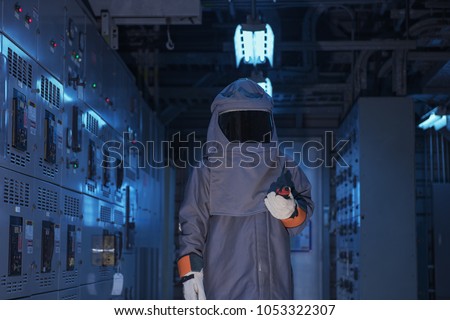Electrical worker wearing arc flash suit  protection