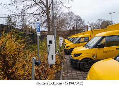 Electrically driven postbuses are refueled at a charging station, germany, 22.11.2020, Forst - Shutterstock ID 1919475431