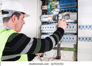 Electrician Checking A Fuse Box