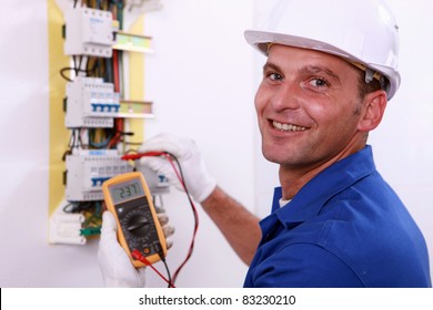 Electrician Checking A Fuse Box