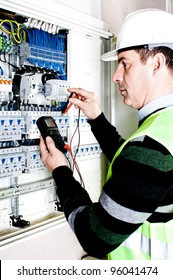 Electrician Checking A Fuse Box