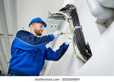 Electrician Doing Cable Installation And Maintenance In Office