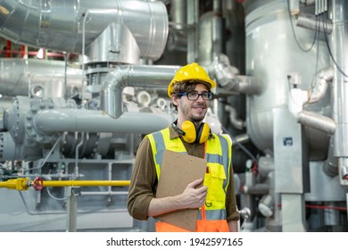 Electrician engineer checking technical data of heating system equipment and piping air compressor system at manufacturing factory. - Powered by Shutterstock