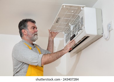 Electrician Examine Or Install Air Condition Device In A Room