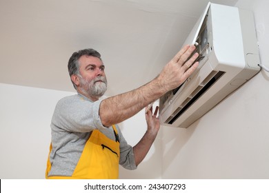 Electrician Examine Or Install Air Condition Device In A Room